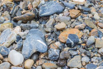 Colorful Rolling Stones Pattern With Water Flowing On Top