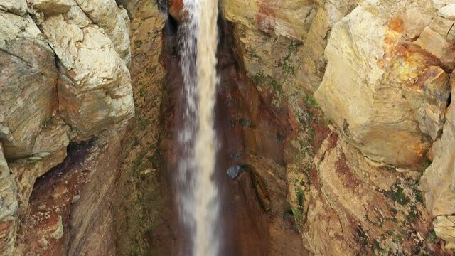 Aerial tilt view on colorful Dangerous Canyon (Opasniy Canyon) near the Mutnovsky volcano on the Kamchatka Peninsula, Russia, 4k