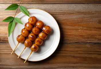 Mitarashi dango placed on a wooden background