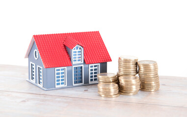 Small house model and euro coin