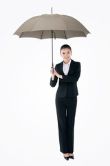 Oriental fashion business woman holding an umbrella