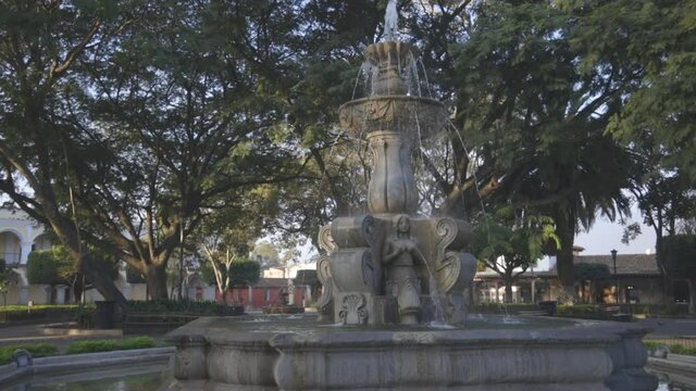Fountain of the Sirens in the central park of Antigua Guatemala - beautiful colonial park with a fountain in Antigua Guatemala 