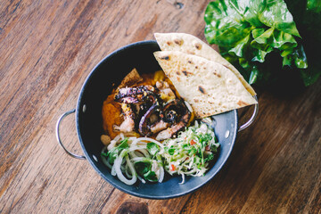 octopus with pumpkins hummus