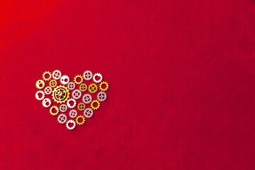 heart shape made of gears, red background