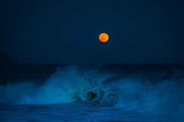Orange Moon Over an Empty Wave