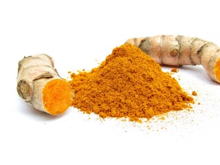 Turmeric powder and roots isolated on white background