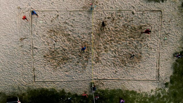 People playing volleyball on the beach in the small Caribbean country of Saint Lucia.