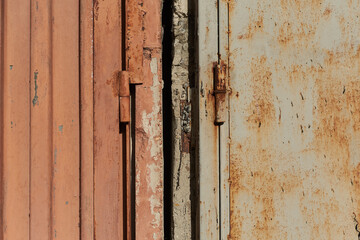 Closeup texture detail of outdoor garage cell hinges rusty old aged metal concrete in Sofia, Bulgaria, Eastern Europe