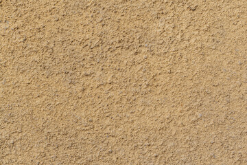 Aged termal isolation yellow wall texture grain rough surface low quality construction in Sofia, Bulgaria, Eastern Europe