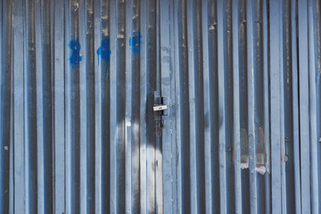 Old grunge and dirty metal closeup of steel door with door handles and lock vintage retro style background and texture in Sofia, Bulgaria, Eastern Europe