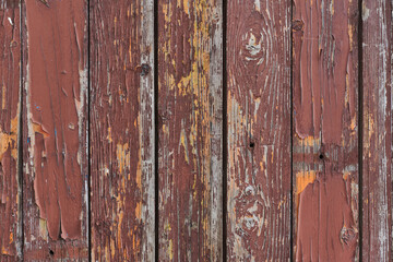Rusty old wooden garage door painted in red texture rural street poor neighborhood in Sofia, Bulgaria, Eastern Europe