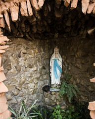 Artificial grotto with a Holy Mary statue inside for prayers