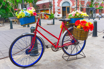 Fototapeta na wymiar bike with flower decoration in old city