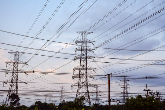 Electricity pole with dark sky before sunrise, Transmission line of electricity to rural, electricity transmission pylon