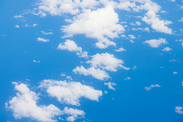 Fototapeta na wymiar Capturing the fluffy white clouds and the blue sky