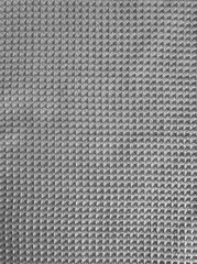Waffle fabric, natural cotton, fabric texture. Gray kitchen towel textile abstract background or wallpaper, close-up.