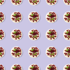 Seamless pattern from galettHealthy breakfast with rice cake and pomegranate on light violet flat lay.