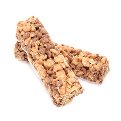 Cereal bar or breakfast snack made from oat flakes, caramel and puffed cornes isolated on white