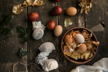 Fototapeta na wymiar Eco decor. Easter eggs boiled in onions peels. Spring festive easter autentic background.