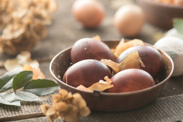 Eco decor. Easter eggs boiled in onions peels. Spring festive easter autentic background