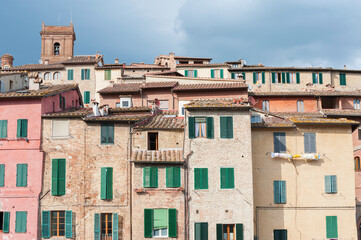 Fototapeta na wymiar Exterior of old residential building in Siena, Tuscany, Italy