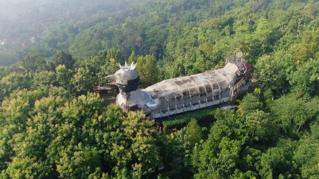 Famous Chicken Church in lush green tropical forest on Java, Indonesia, aerial