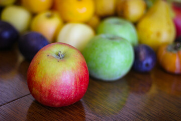 Fruit background. Apples, oranges, pears, persimmons, plums.