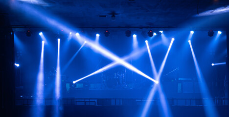 Empty stage concert with colorful lighting laser beam spotlight show in disco pub club bar background for party music dancing festival performance. Entertainment nightlife. Celebration event.