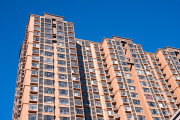 Fototapeta na wymiar High rise residential buildings under blue sky