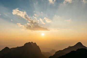 The landscape of Mountains, cloud with sunray and dusk near the sunset of Doi Luang, Chiang Dao, Chiang Mai, Thailand. Taking photo from the summit.