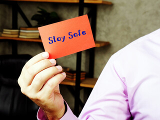  Juridical concept meaning  Stay Safe    with phrase on the piece of paper.