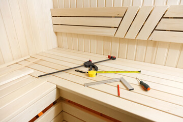 Sauna construction in progress. Wooden walls and benches
