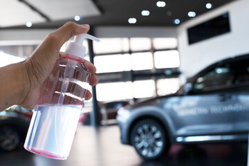 dealership service mechanic maintenance inspection service maintenance car with hand gel sanitizer bottle alcohol lifestyle  new normol during coronavirus covid-19.