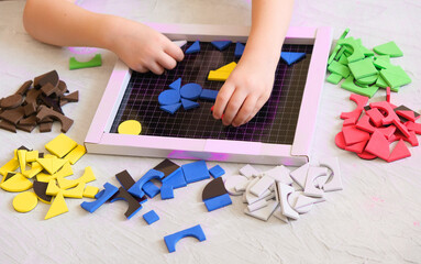 Children mosaic, a game for creativity . Leisure of child, development of fine motor skills and abstract thinking.