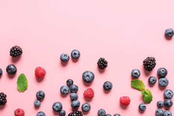 Different ripe berries on color background © Pixel-Shot