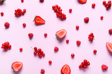 Different tasty berries on color background