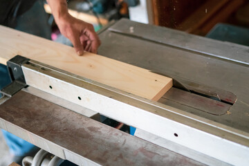 texture of color wood dust sparks over the table, view in the carpenter workshop.
