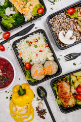 Lunch boxes: dishes in disposable plastic dishes, Russian cuisine - borsch, soup, rice, vegetables, pasta, meat cutlets, mushrooms. Top view