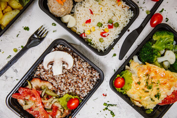 Lunch boxes: dishes in disposable plastic dishes, Russian cuisine - borsch, soup, rice, vegetables, pasta, meat cutlets, mushrooms. Top view