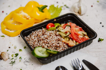 Lunch boxes: dishes in disposable plastic dishes, Russian cuisine - borsch, soup, rice, vegetables, pasta, meat cutlets, mushrooms. Top view