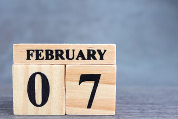 Day 7 of february month, Wooden calendar with date. Empty space for text.