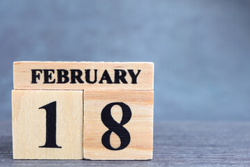Day 18 of february month, Wooden calendar with date. Empty space for text.