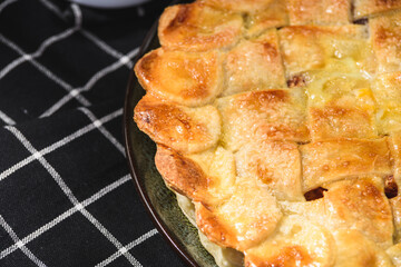 apple pie on a wooden background. Rustic style.