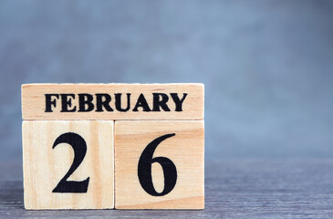Day 26 of february month, Wooden calendar with date. Empty space for text.