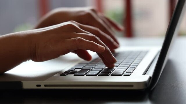 Female hands of business woman professional user worker using typing on laptop notebook keyboard sit at home office desk working online with pc software apps technology concept, close up side view