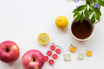 herbal health care mix honey lemon with cough sore throat pastille pills and apple arrangement flat...