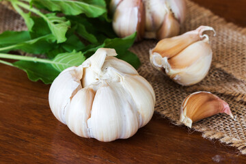 garlic  and basil fresh vegetable  prepare to cook arrangement flat lay style on background wooden