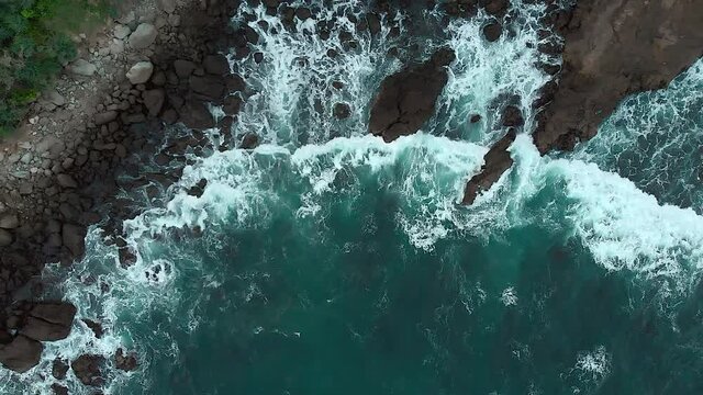 Foamy sea wave top down aerial view