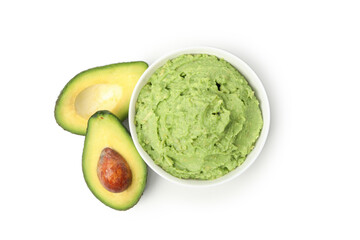 Bowl of guacamole and avocado isolated on white background