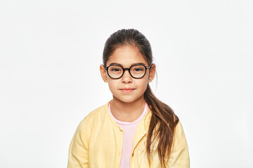 Beautiful asian little girl in stylish glasses on gray background